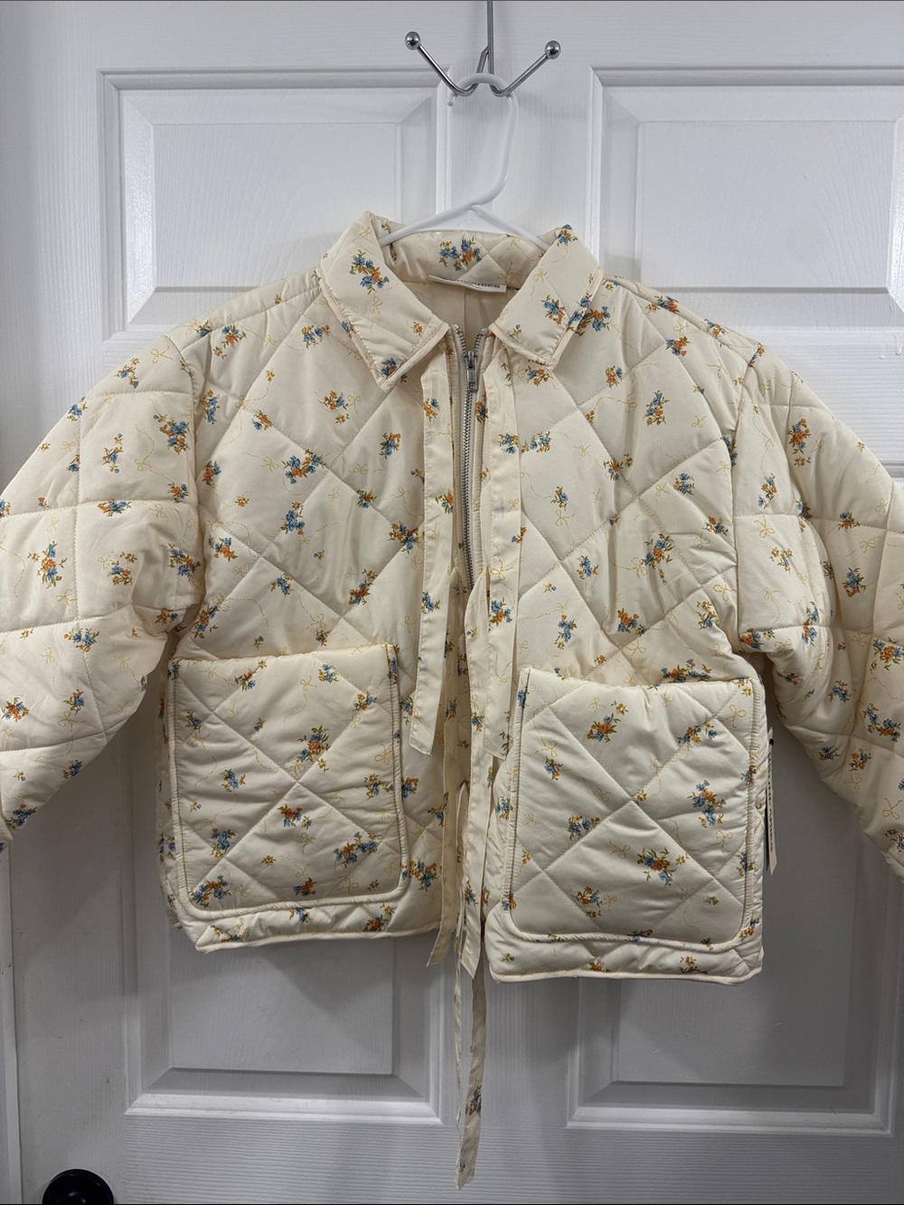 No Boundaries Cream Quilted Floral Puffer Jacket with Blue & Yellow Flowers